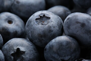 Tasty fresh ripe blueberries as background, closeup