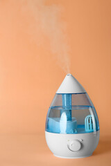 New modern air humidifier on orange background