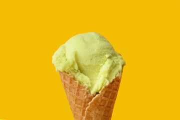 Delicious ice cream in waffle cone on yellow background, closeup