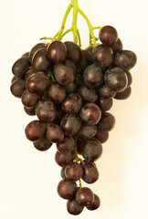 a bunch of ripe grapes lies in the kitchen