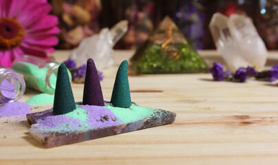 Incense Cones on Stone Slab With Crystals and Flowers