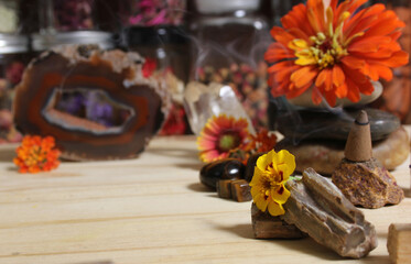 Agatized Coral With Quartz Crystals and Flowers on Meditation Table