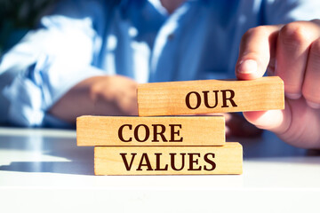 Wooden blocks with words 'Our core values'. Business concept