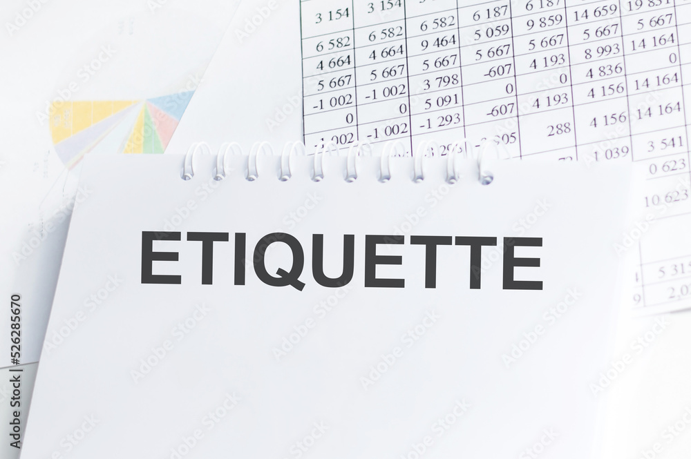 Poster etiquette text on notepad on a table with background reports and charts