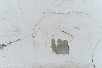 Repair point for cracked and peeling wall paint