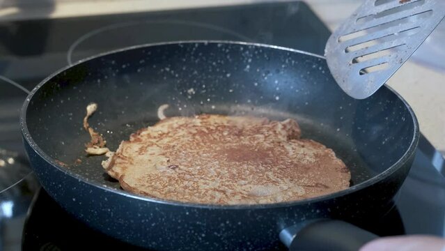 making buckwheat pancakes in the pan. 