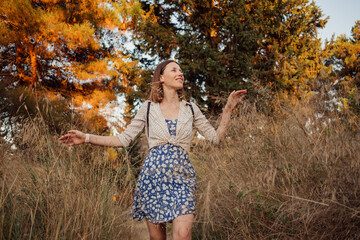 Woman traveler exploring a light Mountain travel path destination