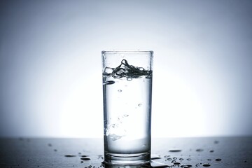This is photo of water scattered in glass.