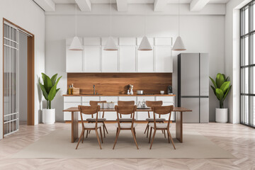 Light kitchen interior with dining table and kitchenware, panoramic window