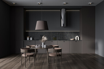Dark kitchen interior with seats and eating table on wooden floor