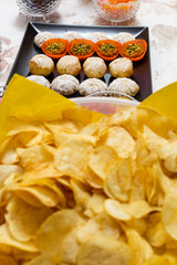 Chips and cake for birthday party on a table