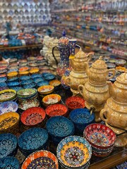 Ceramics souvenirs in different colors. Colorful market. Decorative objects. 