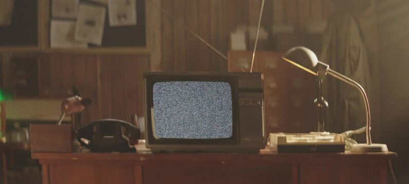 A Vintage Television In The Retro Office. Old TV standing on an old table. Retro atmosphere.