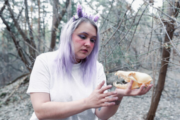 fairy in purple in the forest