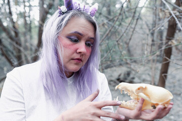 fairy in purple in the forest