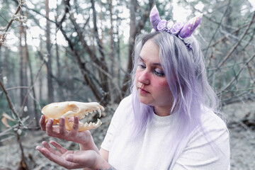fairy in purple in the forest