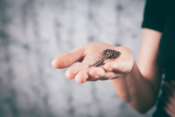 young girl holding house keys