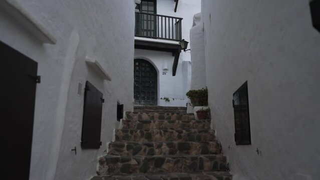 Whitewashed buildings in Binibeca Vell at dusk, Punta Prima, Menorca, Balearic Islands