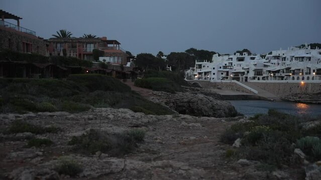Whitewashed buildings in Binibeca Vell at dusk, Punta Prima, Menorca, Balearic Islands