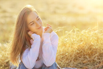 summer sunny portrait of a happy girl, female happiness sun glare straw field country style