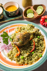Arroz con pollo chicken leg green rice peru peruvian gourmet restaurant popular comfort food