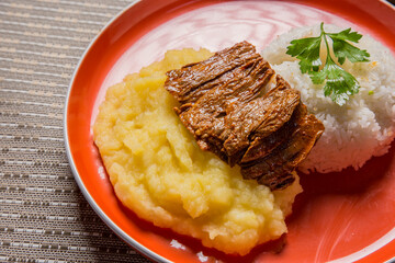 Fried meat mashed potatoes peru peruvian gourmet restaurant popular comfort food