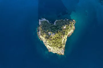 Kussenhoes Aerial view from above of the beautiful heart-shaped natural island in the Mediterranean Sea along the coast of Liguria, Italy © Mike Dot