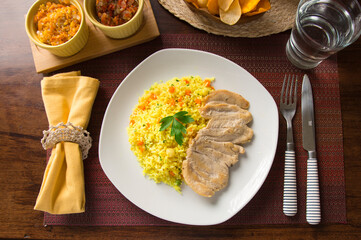 Light chicken filet and yellow rice Peruvian gourmet restaurant food