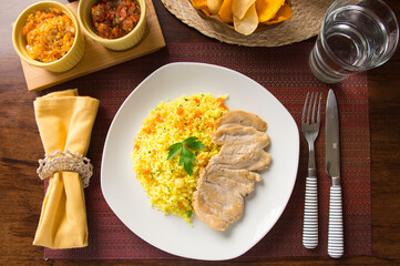 Light chicken filet and yellow rice Peruvian gourmet restaurant food