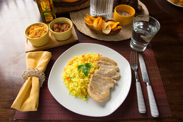 Light chicken filet and yellow rice Peruvian gourmet restaurant food
