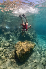 freediver girl in the sea. underwater shoot.