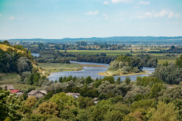 Nature of Ukraine in summer on a sunny day River and forest, countryside