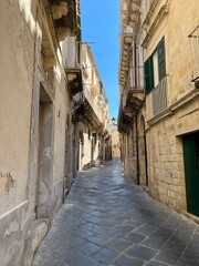 Fototapeta na wymiar A street in Ortygia, historic part of Syracuse, Sicily