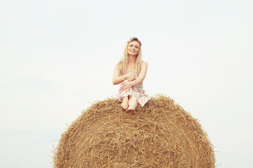 Naklejka na ściany i meble girl on a haystack summer freedom romantic model