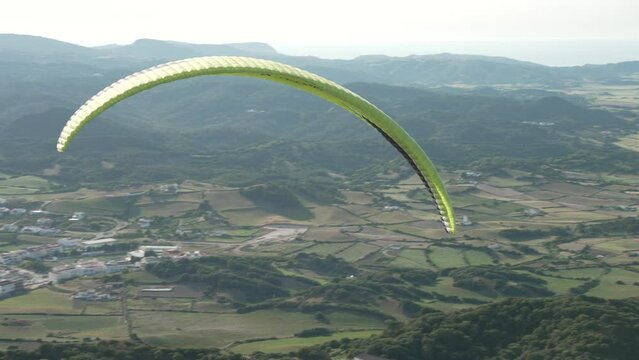 Paraglider from mountain top of Mirador Cim del Toro, Es Mercadal, Menorca, Balearic Islands