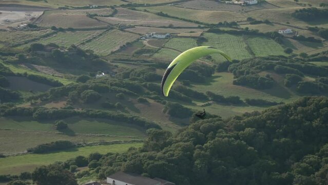 Paraglider from mountain top of Mirador Cim del Toro, Es Mercadal, Menorca, Balearic Islands