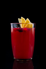 cranberries lemon ginger drink in a glass beaker, cranberries