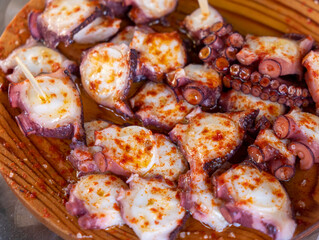 Ration of pulpo a feira, typical Galician recipe for cooking octopus.