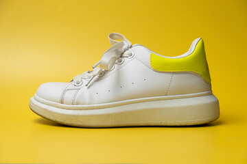 A dusty dirty sneaker. Shoes that require cleaning.