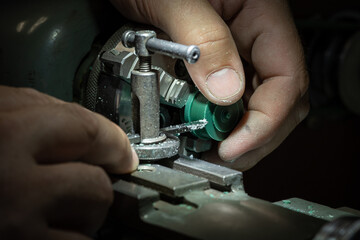 Different goldsmiths tools on the jewelry workplace. Jeweler at work in jewelry. Desktop for craft jewelry making with professional tools. Close up view of tools.