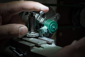 Different goldsmiths tools on the jewelry workplace. Jeweler at work in jewelry. Desktop for craft jewelry making with professional tools. Close up view of tools.