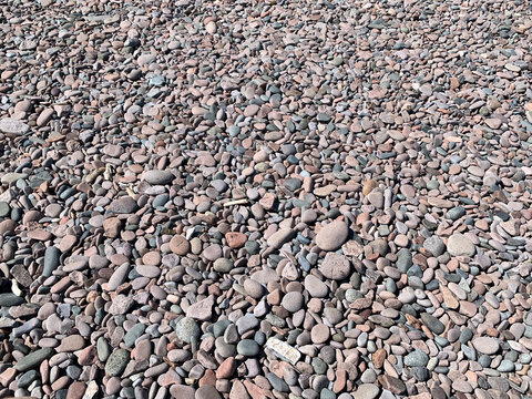 Smooth rocks on a lake beach
