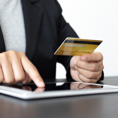 women use Tablet to register online purchases using credit card payments, Convenience in the world of technology and the internet, Shopping online and banking online concept.