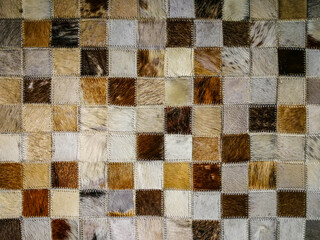 Background of a checkered animal fur rug