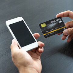 women use smart phone to register online purchases using credit card payments, Convenience in the world of technology and the internet, Shopping online and banking online concept.