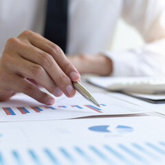 Head of marketing has analyzed the financial income graph of the company in order to develop the structure of the company to be ready for the economy in the future. Financial results analysis concept.