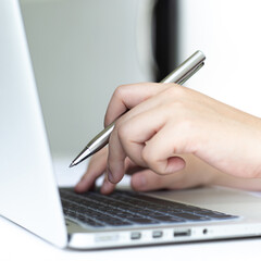 Financial businessmen use laptop to analyze marketing strategies and real estate data to reduce company taxes for their customers, Accounting and Tax concept.