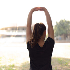 Athletes are stretching their muscles to warm up or exercise in the park in the morning, Exercise for healthy lifestyle concept.