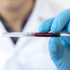 Scientists or doctors collect blood samples from new strains of virus patients for analysis and vaccination in the research laboratory, Vaccine research to eliminate viruses concept.