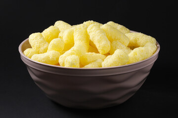 Sweet corn sticks in a bowl. Shallow depth of field